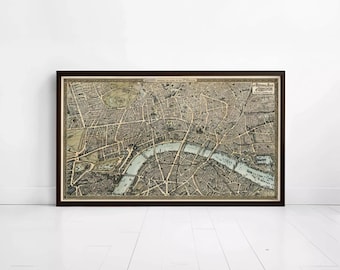 May include: A framed historical map of London featuring a detailed street layout, the River Thames in a light blue hue, and text at the top reading London Towards the Close of the 16th Century and a label for the Borough of London in the corner.