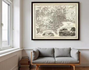 May include: A framed vintage map of Naples, Italy, dated 1884, featuring detailed topographical lines, urban street layouts, and coastal geography. The print includes a decorative border and two small illustrative vignettes of local landscapes.