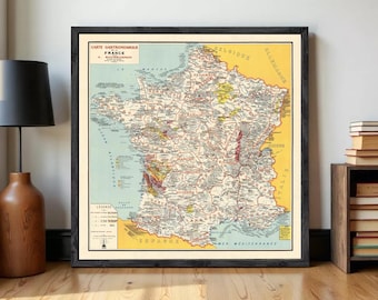 May include: A framed vintage-style map titled Carte Gastronomique de la France par A. Bourguignon, featuring detailed regions of France in shades of yellow, blue, and cream, with a legend in the bottom left corner and a dark wooden frame.
