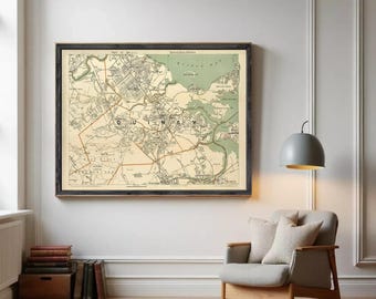 May include: A framed vintage map of Quincy, Massachusetts, showing the city's layout with streets and waterways. The map has a cream-colored background and is framed in dark wood. The word "Quincy" is clearly visible. The frame adds a classic touch to the map.