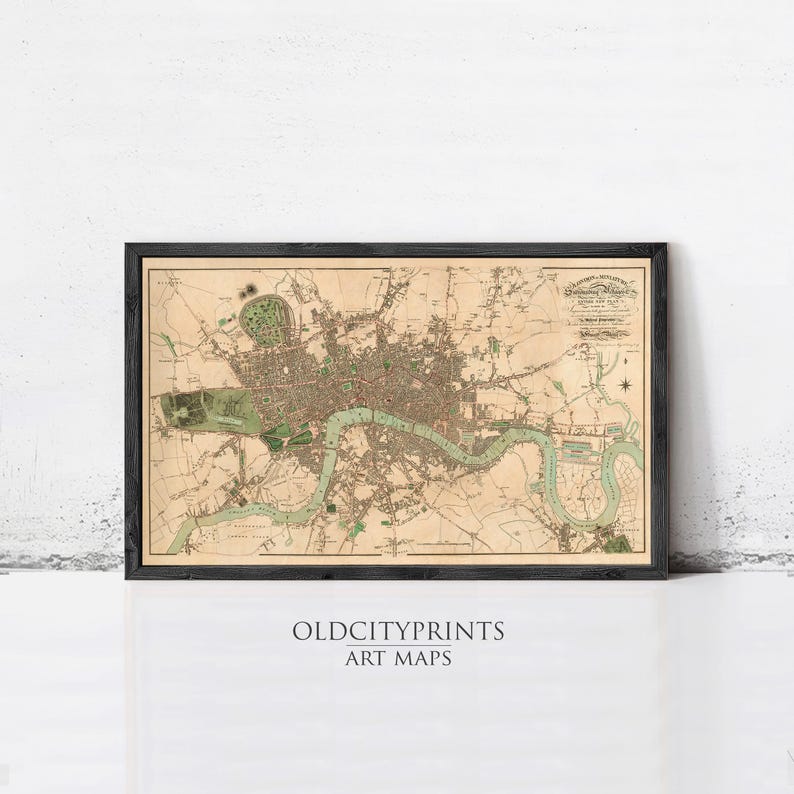 The image is a framed vintage map of London, England, depicting the city's streets, landmarks, and surrounding areas.