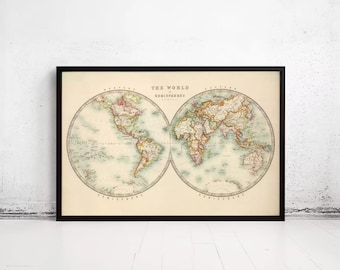 May include: A framed vintage-style map print titled The World in Hemispheres, featuring two circular projections of the Earth with muted pastel landmasses and pale blue oceans on a cream-colored background, enclosed in a thin black frame.