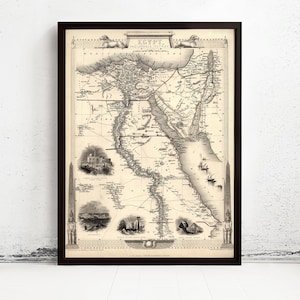 Może przedstawiać: Oprawiona zabytkowa mapa Egiptu i Arabii Petraea w czerni i bieli. Mapa przedstawia szczegółową topografię, linie brzegowe oraz małe ilustracje zabytków, w tym piramidy i obeliski, wraz z opisami tekstowymi.