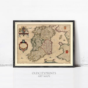 May include: Framed vintage map of Ireland, featuring detailed cartography with historical illustrations and text. The map is in a black frame, with the text "OLDCITYPRINTS ART MAPS" at the bottom.