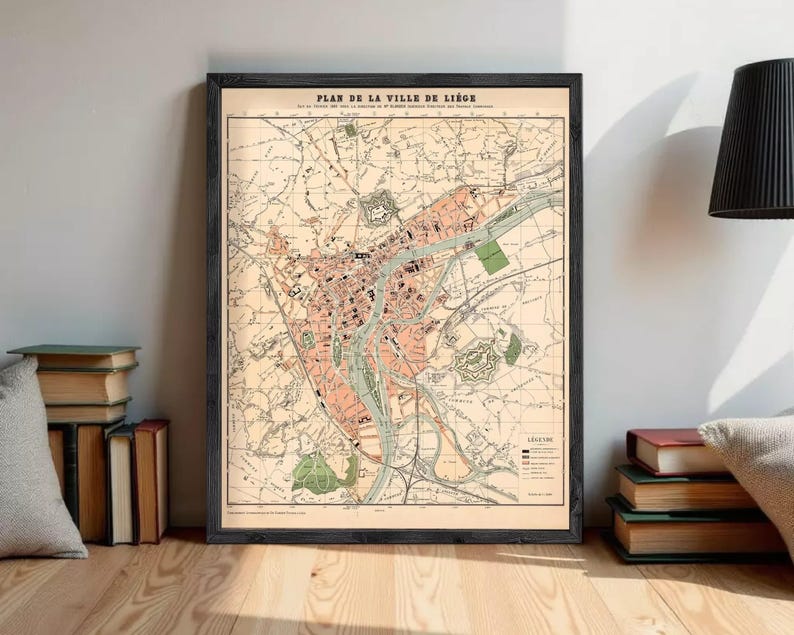 The image is a framed vintage map of a city, depicting various landmarks and streets.