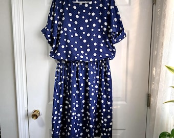 Vestido vintage de lunares azules y blancos con mangas de alas de ángel de Starlo