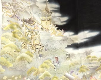 May include: An ornate, detailed illustration featuring a golden carriage and pagoda-style structures set against a backdrop of stylized clouds and foliage. The color palette includes gold, cream, and black.