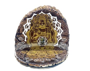 May include: A wooden shelf with a gold and white mandala design featuring a Buddha figure. The shelf is decorated with crystals and has a natural wood finish.