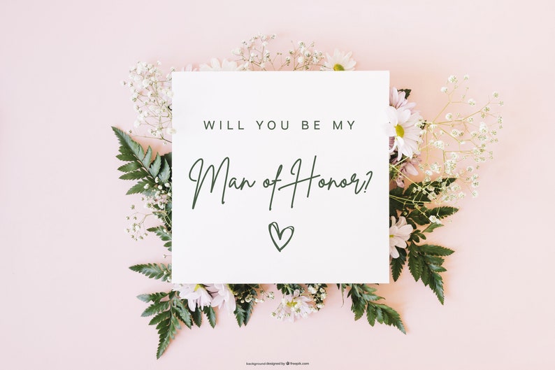 Pode incluir: Um cart&atilde;o branco com o texto "Voc&ecirc; quer ser meu padrinho?" escrito em fonte de caligrafia preta com um pequeno cora&ccedil;&atilde;o desenhado abaixo do texto. O cart&atilde;o est&aacute; rodeado de flores brancas e rosas sobre um fundo rosa claro.
