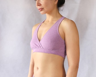 May include: A lavender-colored, soft, stretchy, racerback bra with a V-neckline.