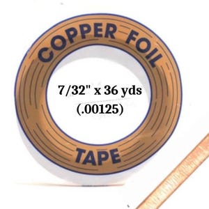 May include: A roll of copper foil tape with the text "COPPER FOIL TAPE" in a brown circle with gold stripes. The text "7/32" x 36 yds (.00125)" is printed in black inside the circle.