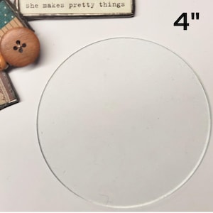 May include: A clear glass circle, 4 inches in diameter, for crafting projects.