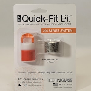 May include: A close-up of a packaging for a Quick-Fit Bit 200 Series System. The packaging shows a red and white bit holder with a silver bit. The text on the packaging reads "Quick-Fit Bit", "Shock Absorbing Bit with a Quick Changing Grit", "200 Series System", "Free Standard Bit Included", "Prevents Chipping, No Keys Required, Reusable Holder", "Bit Holder Diameter", "3/4" (19 mm) Diameter", "1" (25 mm) Diameter", "Techniglass", "Made in the USA", and "US & Foreign Patents Issued".