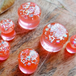 Iridescent plugs GLOWING PLUGS gauges 4g plugs 2g gauges 0g ear plugs 00 gauges 28mm plug Star plug Barbiecore Neon Peach glow in the dark