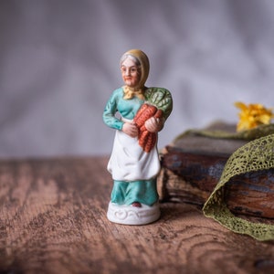 Bisque Porcelain Granny Figurine: Hand-Painted Carrot Harvest Decor