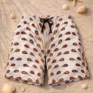 May include: White swim shorts featuring a repeating pattern of orange and brown teardrop shapes. The shorts have a black drawstring and are displayed on a sandy surface with seashells and a starfish.