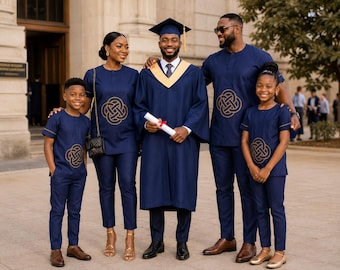 May include: A family wearing matching navy blue outfits with gold embroidered circular knot patterns. The central figure wears a navy blue graduation gown with a gold stole and cap, holding a white diploma tied with a red ribbon. All garments feature short sleeves and clean lines.