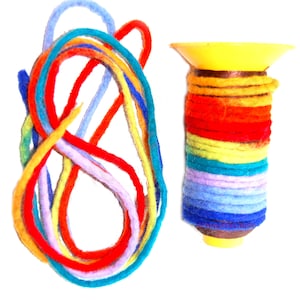 May include: A spool of rainbow colored yarn with a yellow plastic spool. The yarn is made of wool and is approximately 100 yards long.