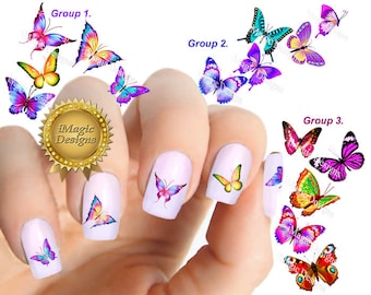 Op de afbeelding: Een set nageldecoraties met kleurrijke vlinderontwerpen. De stickers zijn onderverdeeld in drie categorieën: Groep 1, Groep 2 en Groep 3. Elke groep heeft een verscheidenheid aan vlinderontwerpen met verschillende kleuren en patronen.