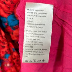 Vestido corto floral Yara de Free People, nuevo con etiquetas, color rosa, mangas fluidas con volantes y bolsillo, talla M. imagen 11