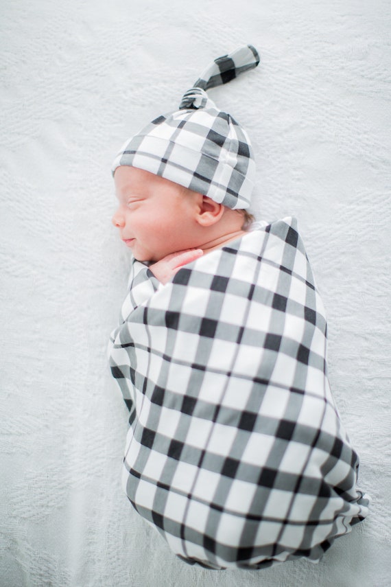 cute baby boy swaddles