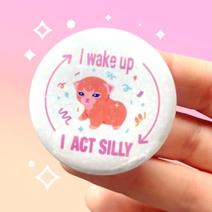 I wake up, I act silly cat sparkly pin back button 44mm badge | Cute funny tired quote meme cat | Holographic | Kawaii aesthetic