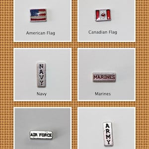 May include: Six silver charm pendants with different designs. The charms are for a bracelet or necklace. The charms feature the American flag, Canadian flag, Navy, Marines, Air Force, and Army.