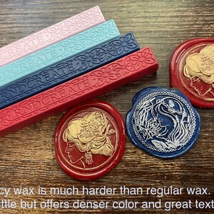 May include: Four sticks of sealing wax in pink, blue, navy blue, and red with the word "RNDCREATE" embossed on each stick. Three wax seals are shown, one with a gold design on a red background, one with a silver design on a blue background, and one with a gold design on a red background.