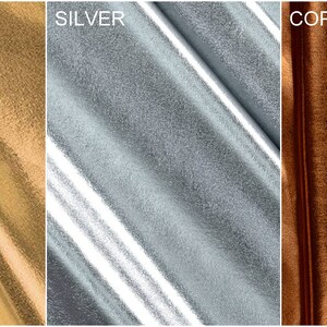 May include: Close-up of three fabric swatches in gold, silver, and copper metallic finishes. The fabric has a smooth, shiny texture.