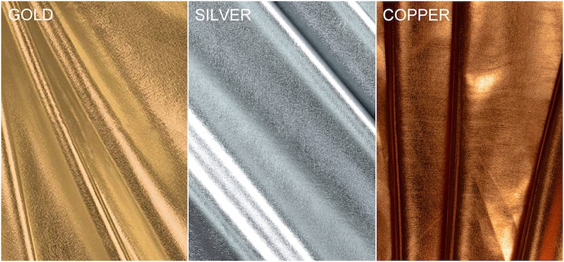 May include: Close-up of three fabric swatches in gold, silver, and copper metallic finishes. The fabric has a smooth, shiny texture.