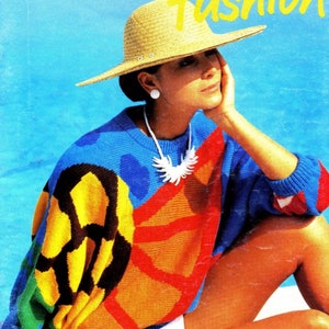 May include: A woman wearing a colourful knitted sweater with a geometric pattern in shades of blue, yellow, orange and red. She is wearing a straw hat and a white swimsuit. The background is a blue swimming pool.