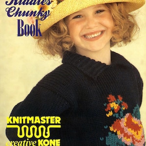 May include: A young girl wearing a blue knitted sweater with a floral design and a yellow straw hat with pink flowers. The text "The Kiddies Chunky Book" is printed in blue and yellow on the top of the image. The text "Knitmaster creative kone CHUNKY" is printed in yellow at the bottom of the image.