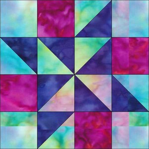 May include: A quilt block with a geometric pattern of blue, green, and pink triangles and squares.