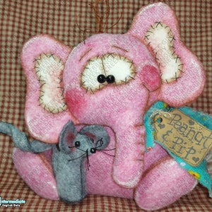May include: A pink felt elephant with a gray felt mouse. The elephant has black bead eyes, stitched details, and a tag that reads "Peanut & Pip". The background is a red and white checkered pattern.