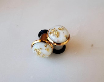 White resin with gold and opalescent flakes in a gold bezeled setting plugs gauges 8g 6g 4g 2g 0g 00g 7/16” 1/2” 3mm-12mm