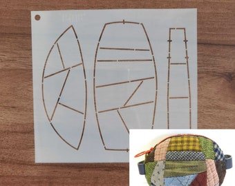 May include: A white stencil with brown lines and shapes for a bag design. A small, round patchwork bag with a blue handle is in the lower right corner. The bag is made of various fabric scraps in different colors and patterns.