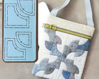 May include: A light blue quilting template with curved shapes and a crossbody bag. The bag features a patchwork design in shades of blue and gray, a yellow zipper, and a light gray strap. The bag is approximately 8 inches wide and 9 inches tall.
