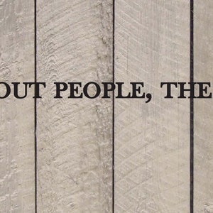 May include: A woodgrain background with a black and white quote that reads "THE MORE I LEARN ABOUT PEOPLE, THE MORE I LIKE MY DOG."  The quote is attributed to Mark Twain.