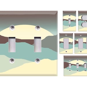 May include: Set of six light switch covers featuring a stylized landscape design with a yellow sun, brown mountains, and blue water. The covers are available in single, double, and triple switch configurations.