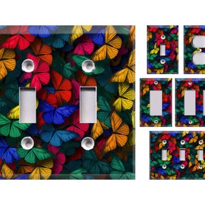 May include: A set of light switch and outlet covers featuring a colorful butterfly pattern. The covers are available in single, double, and triple switch configurations.