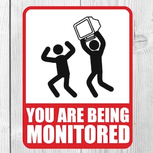 May include: Red and white magnet with a black and white illustration of two stick figures holding a computer monitor above their heads. The text "YOU ARE BEING MONITORED" is printed in black on the red background. The magnet measures 2.31 inches by 3 inches.
