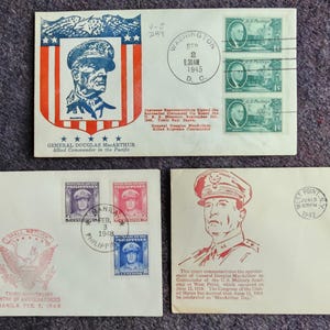 May include: Three vintage envelopes with stamps featuring General Douglas MacArthur. The envelopes are cream colored with red, blue, and green accents. The stamps feature portraits of General MacArthur and text that reads "General Douglas MacArthur Allied Commander in the Pacific" and "Manila, P.I. Feb. 1945".