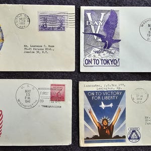 May include: Four vintage envelopes with stamps and postmarks. The envelopes feature patriotic themes, including a torch, an eagle, and the text "Let's keep it Land of the Free".