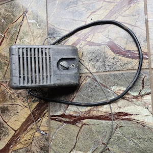 May include: A set of three ceramic mugs with a speckled, matte finish. The mugs are in shades of cream, light gray, and dark gray. Each mug has a simple, minimalist design, perfect for coffee or tea.