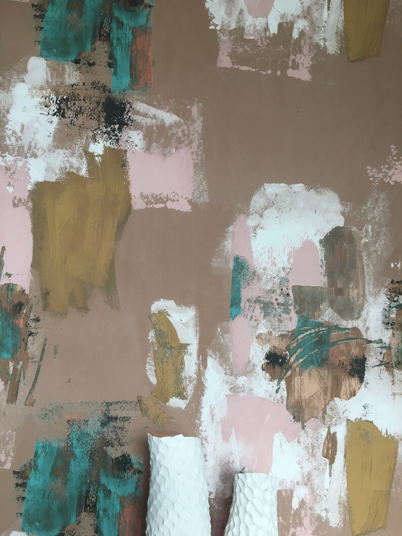 May include: Two white ceramic vases with a textured surface against a brown background with abstract painted shapes in shades of pink, white, teal, brown, and gold.