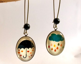 Hanging, bronze earrings, cabochons ovals, black umbrella and cloud, black pearls.