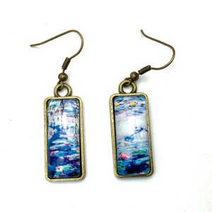 Dangling, mismatched earrings, rectangular cabochons, Nymphéas by Monet.