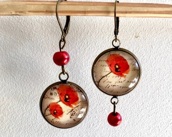 Asymmetrical earrings with poppies and vintage romantic writing, dangling in bronze.