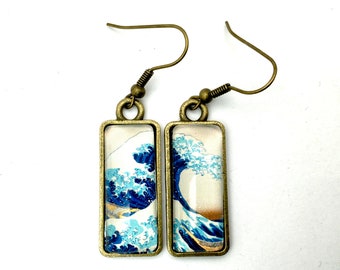 Dangling, mismatched earrings, rectangular cabochons, the great wave of Kanagawa, by Hokusai.