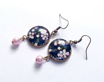 Cherry blossom dangling earrings on a black background, Japanese pattern, pink beads.